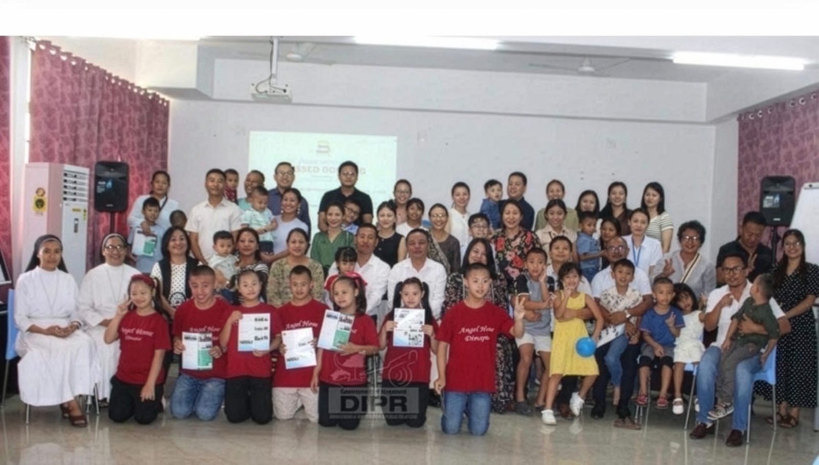 Families, children and volunteers gathered for a group photograph at the Blessed Bonding event